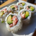 Close-up of a delicious California roll sushi with avocado, crab, and cucumber.