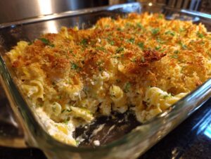 Close-up of Grandma's Tuna Noodle Casserole with a golden breadcrumb topping and visible pasta.
