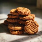 A stack of delicious peanut butter cookies with classic criss-cross fork marks.